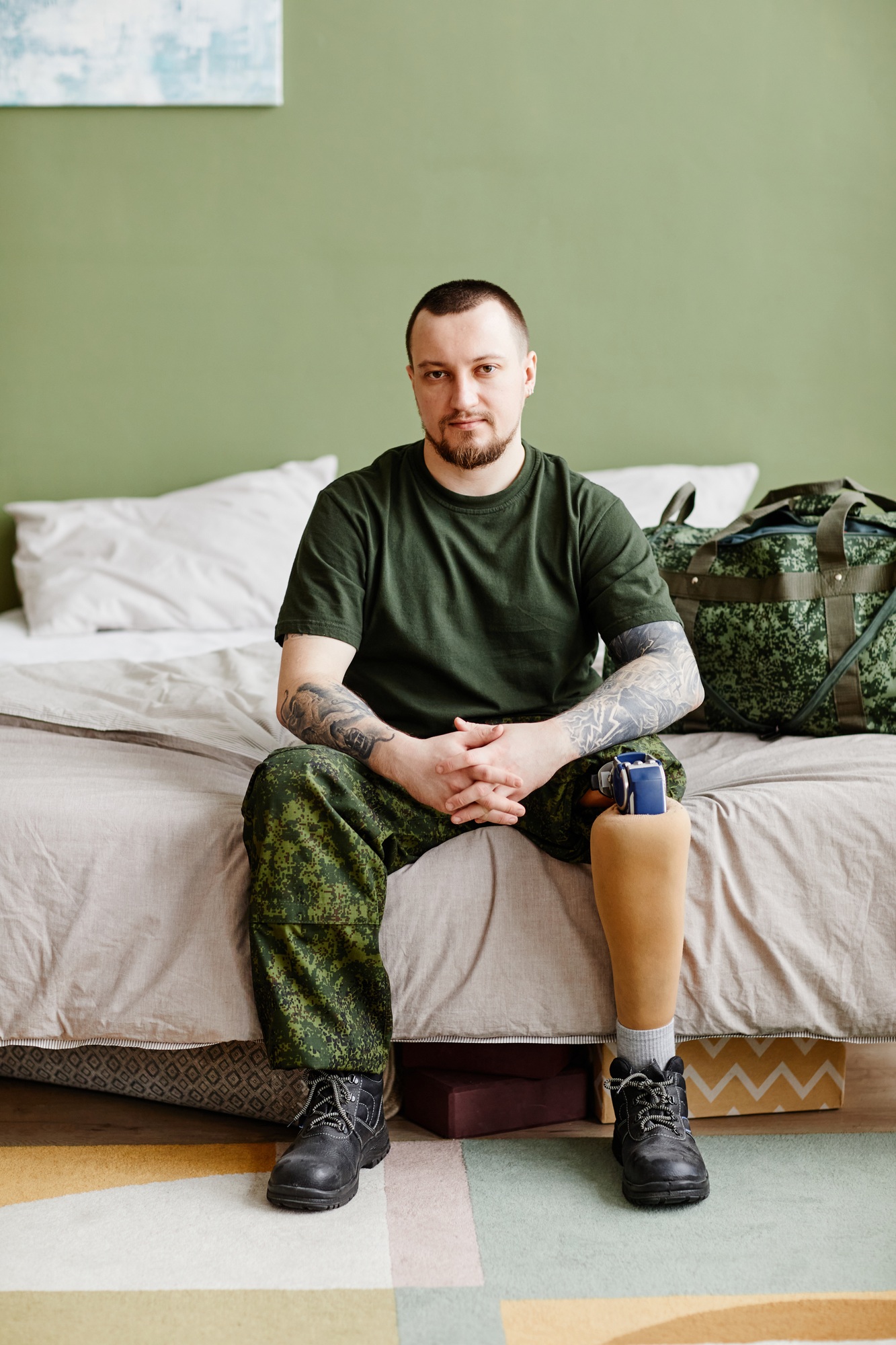 Military veteran with prosthetic leg looking at camera