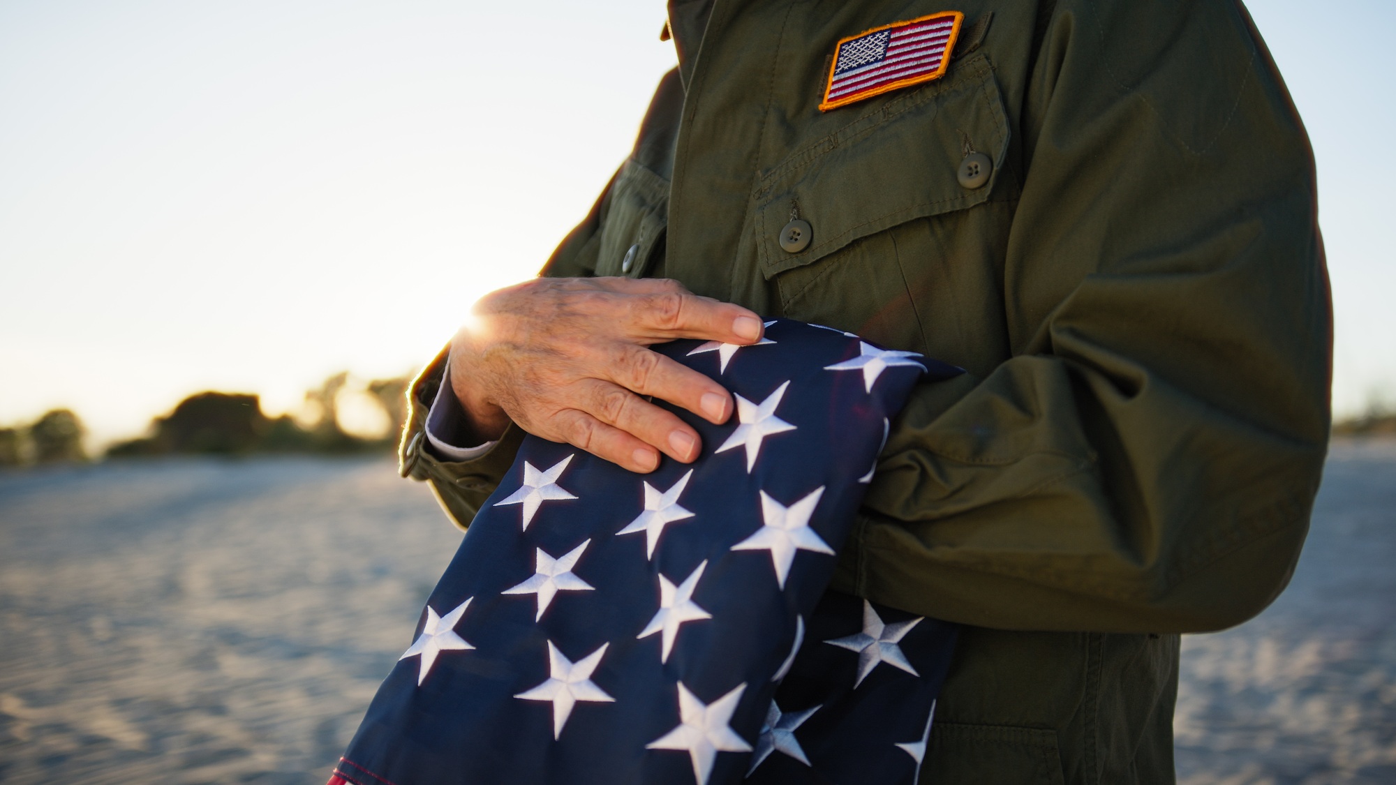 Veteran Soldier Caressing The USA Flag